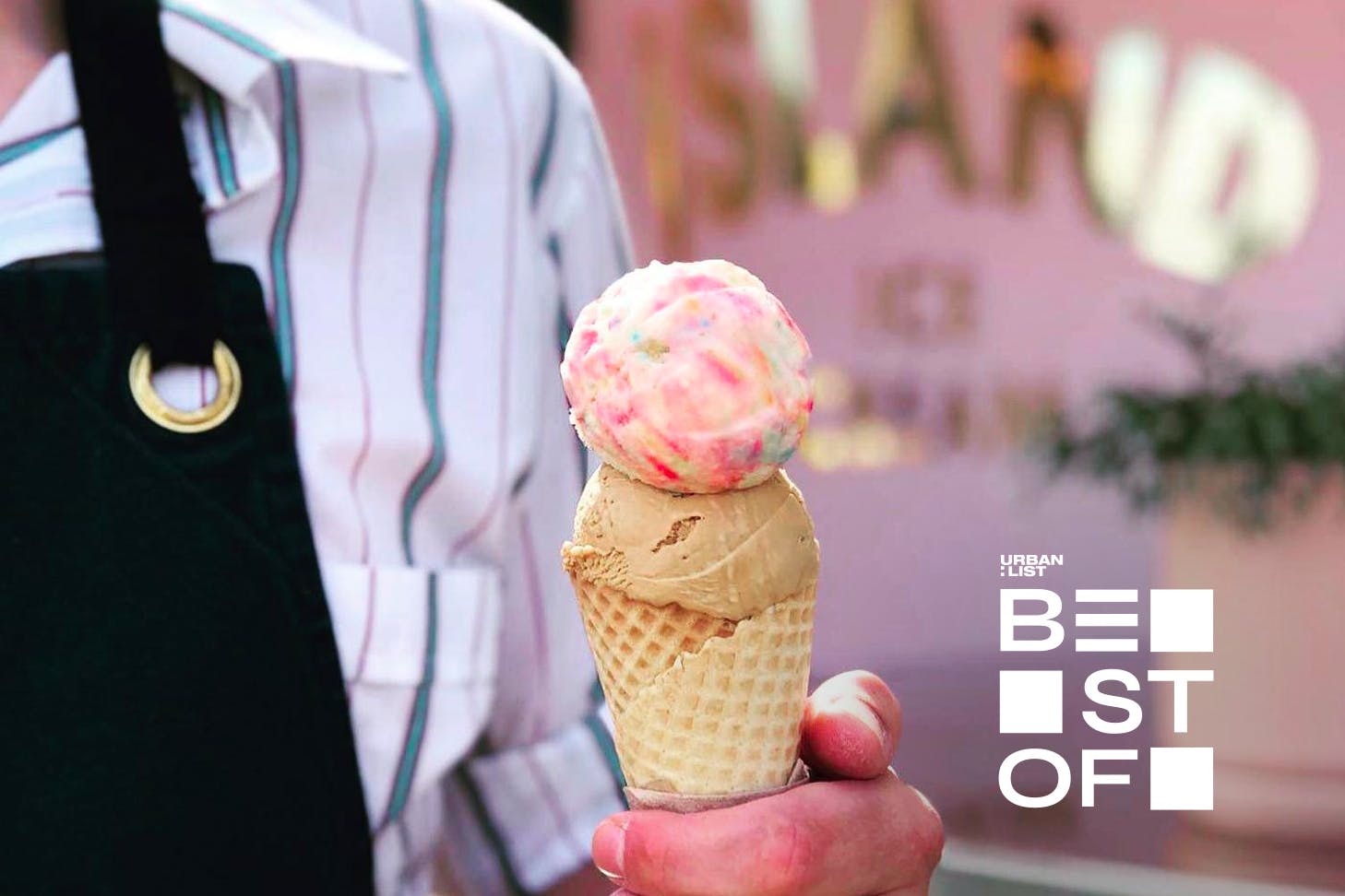 Someone holds a colourful ice cream from Duck Island Ice Cream, one of the best ice cream shops in Auckland.